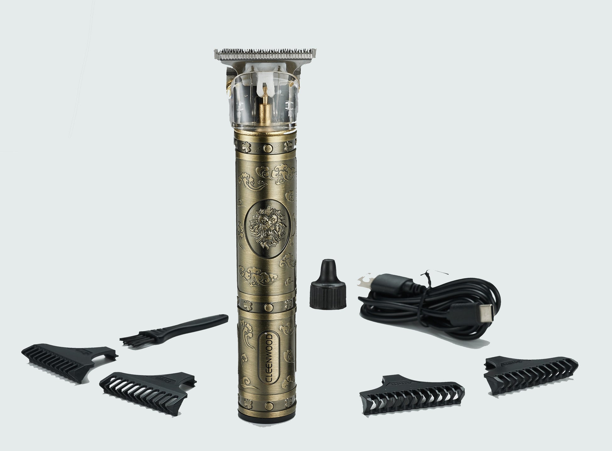 CLEENWOOD CW-714 Rechargeable T-Blade Hair Trimmer, compact gold-colored body, showing the precision stainless steel T-blade used for close hair cutting and detailing.