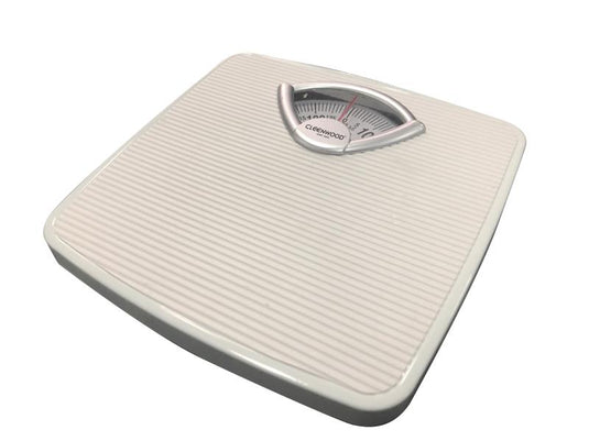 CLEENWOOD CW-753 Mechanical Personal Scale, showing the large circular analogue dial with a 130 KG capacity and the durable, wide, anti-slip standing platform.