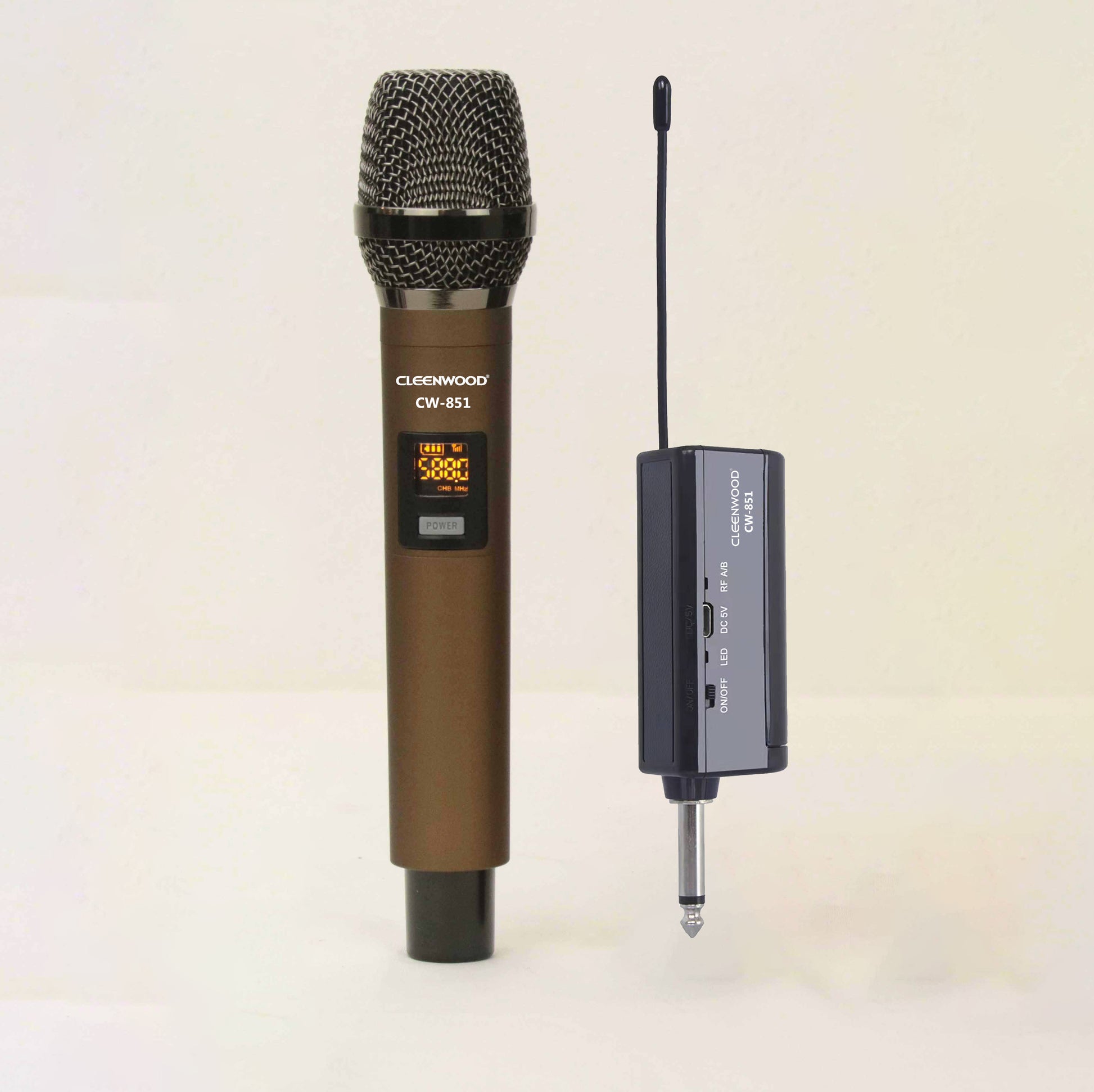 CLEENWOOD CW-851 VHF Wireless Microphone System, showing the small, compact receiver unit with its antenna and the two included handheld microphones.