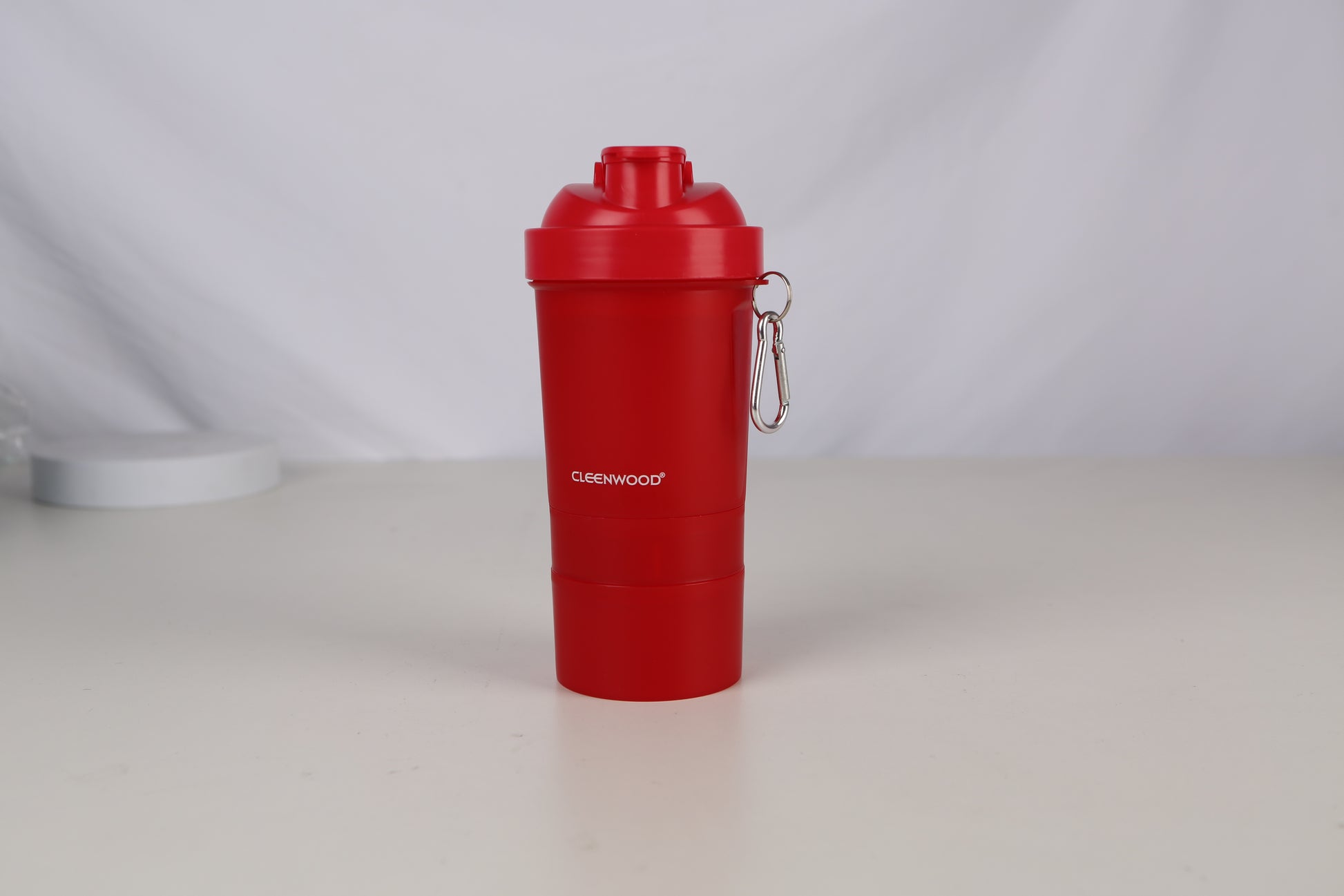 CLEENWOOD CWP-1024 Protein Shaker Bottle, showing the main cup, the secure lid, the separate screw-on base compartments for powder/pills, and the integrated whisk ball/mixer